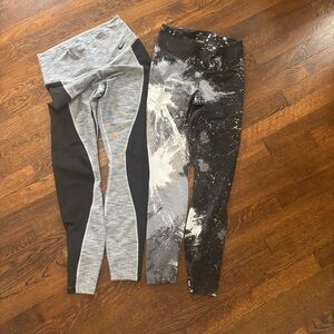two pairs of nike dry fit medium leggings